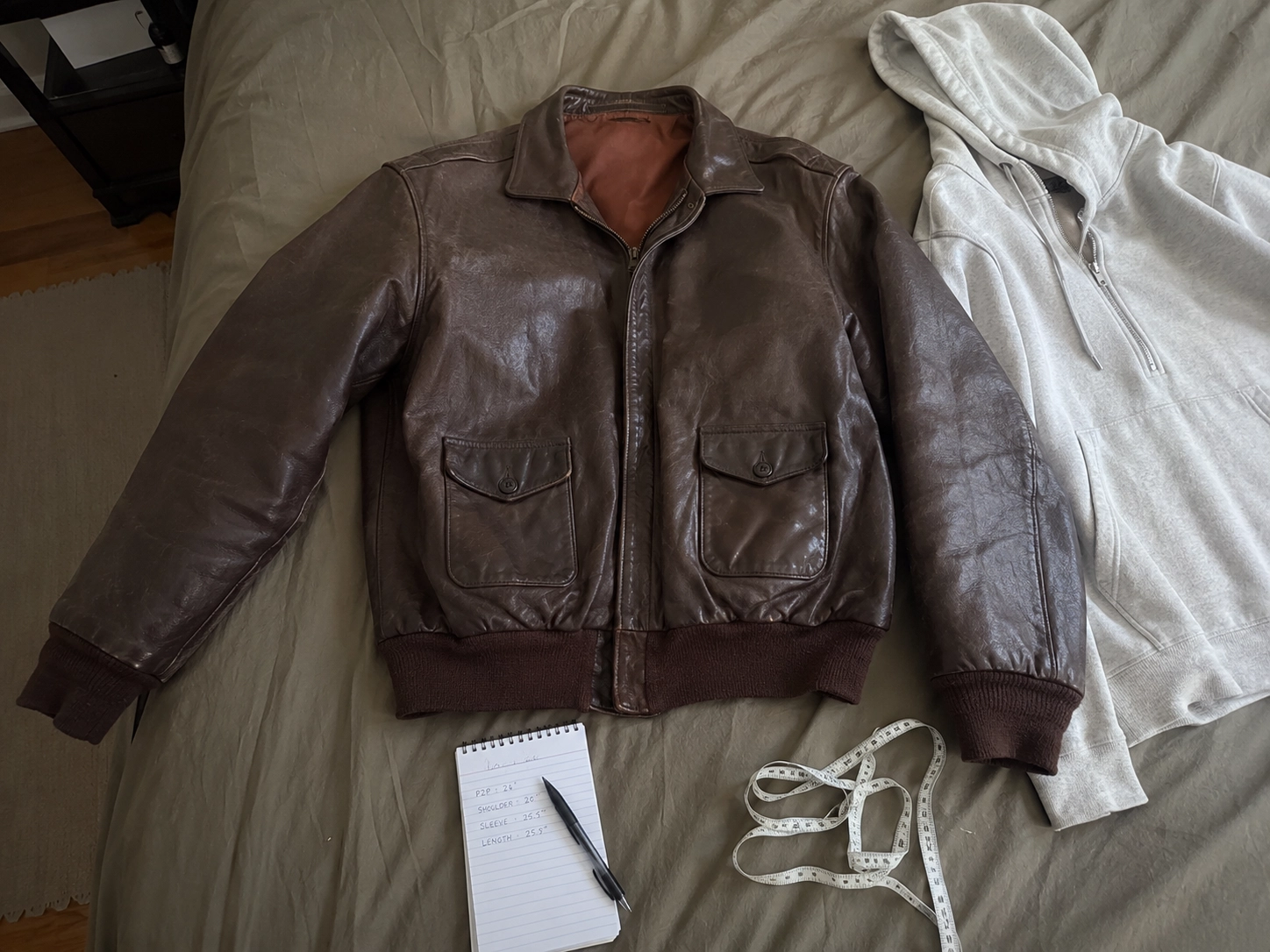 Measuring brown leather jacket